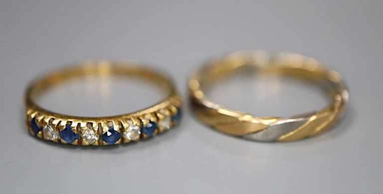 A modern 18ct gold, sapphire and diamond half hoop ring, size K and an 18ct two colour gold band, size J/K, gross 4.1 grams.